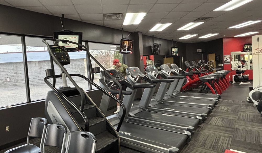 Completed commercial interior with charcoal walls and a red accent wall