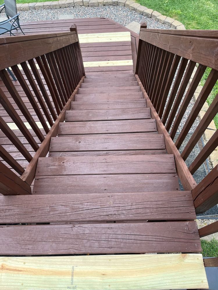 The same deck stairs after a rich brown stain
