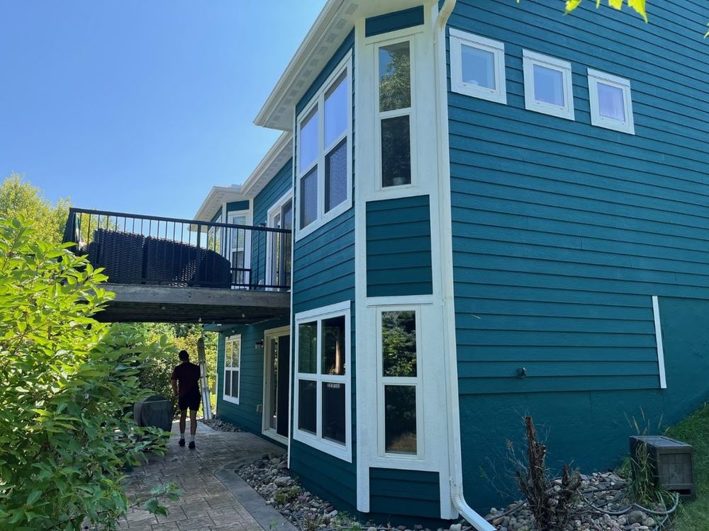 Deep teal home exterior with crisp white trim